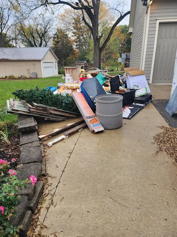 Dumpster being loaded with debris for Demolition Dumpster Rental in Muncy Creek